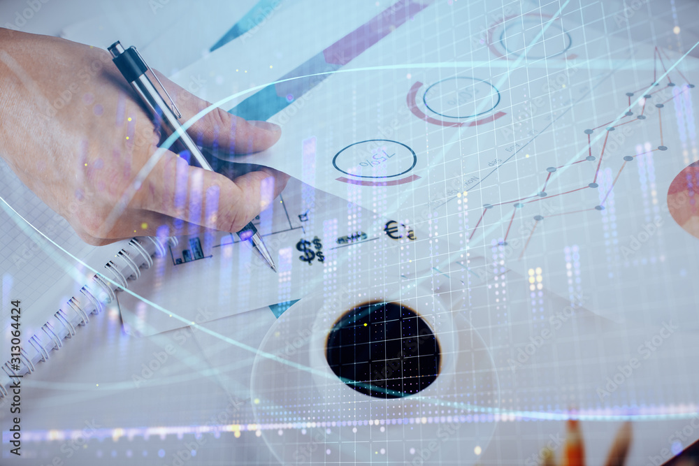Multi exposure of man planing investment with stock market forex chart. Multi exposure of man planing investment with stock market forex chart.
