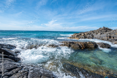 waves crashing on rocks © Bradley