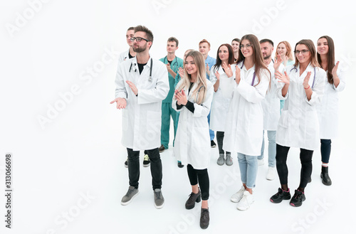 male doctor standing in front of a group of medical students.