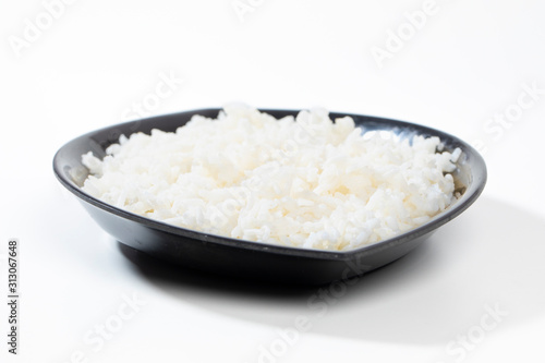 bowl of boiled rice on white background