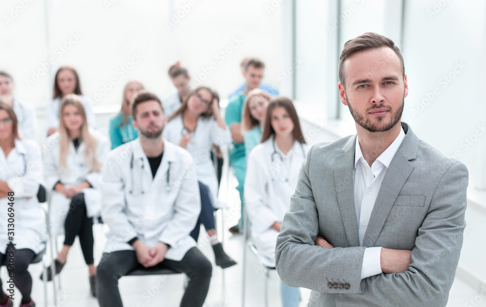 lecturer doctor standing in the conference room.
