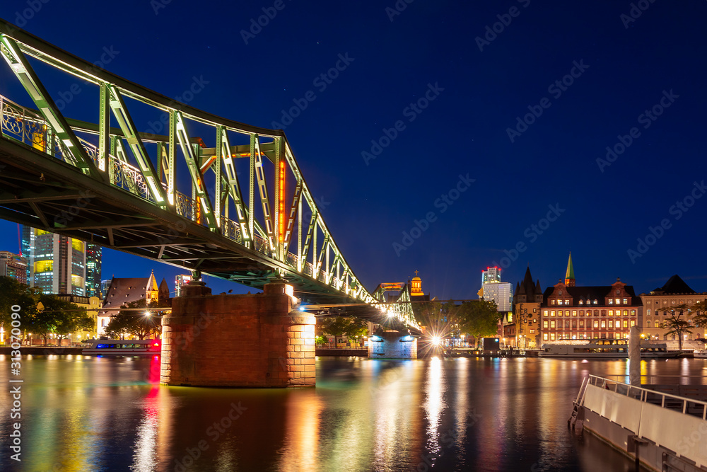 Footbridge accross the Main river in Frankfurt at night