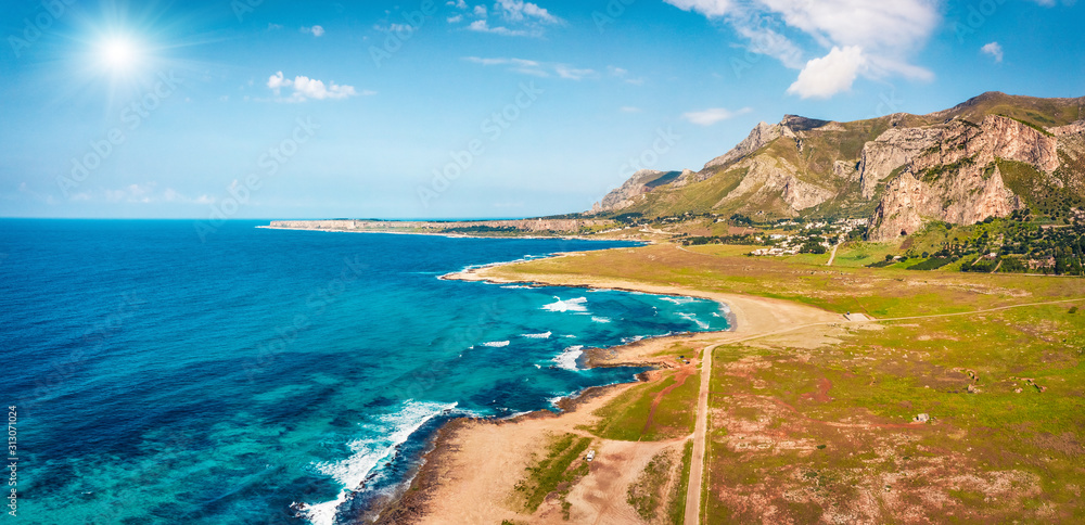 View from flying drone. Attractive spring scene of Monte Cofano National Park, Sicily, San Vito cape, Italy, Europe. Panoramic morning seascape of Mediterranean sea. Traveling concept background.