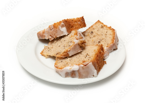 Sweetened cake on a plate with an isolated white background