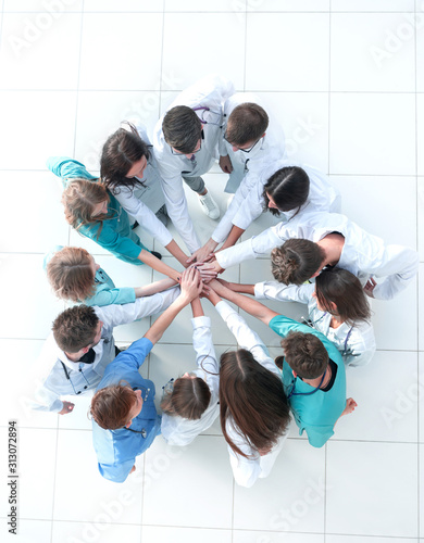 Fotografía top view. image of a group of doctors joining their palms