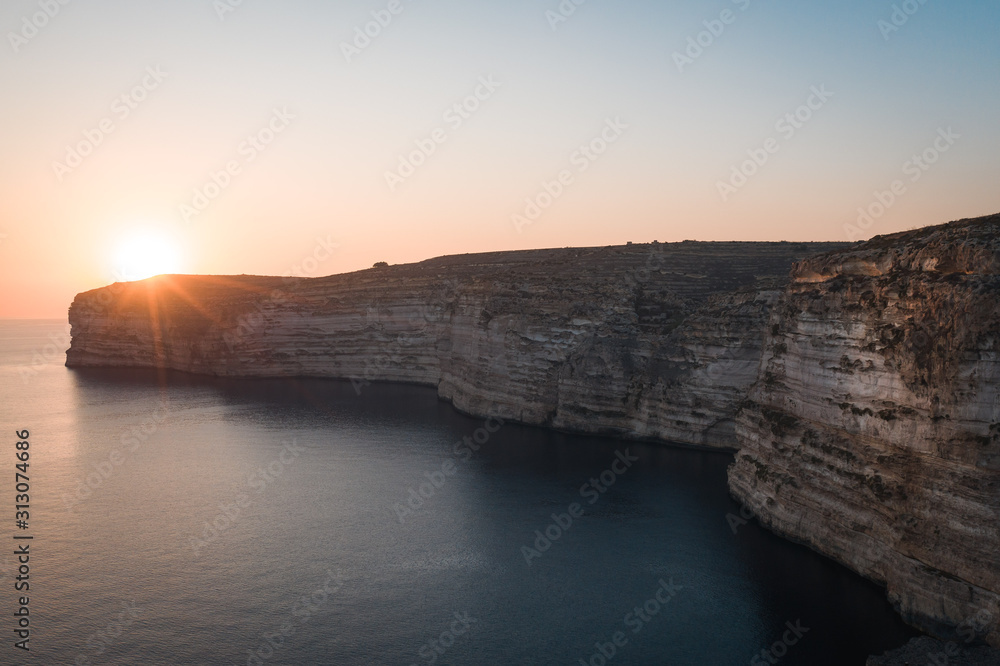 Sunset over the Cliffs of Xlendi in Gozo