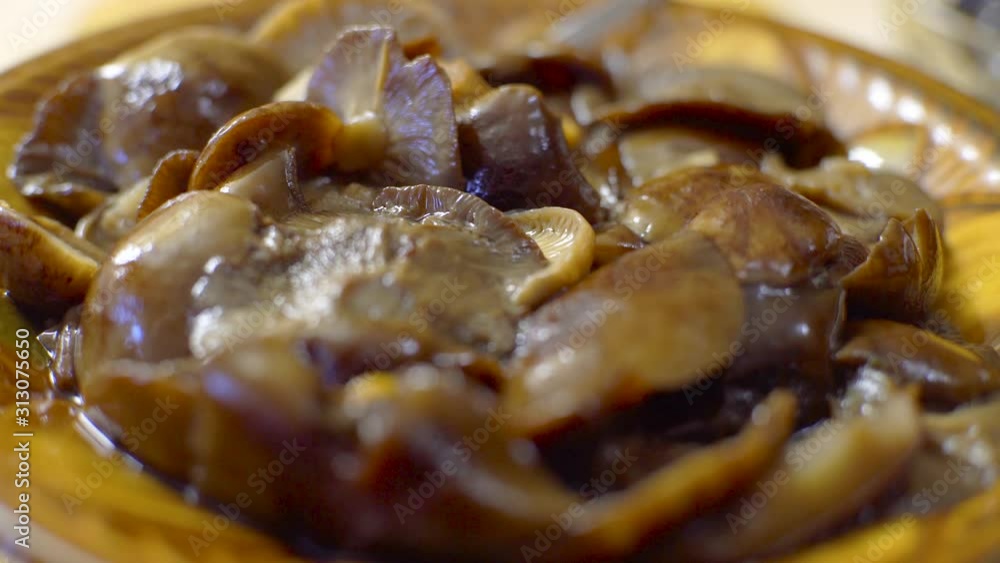 Pickled mushroom salad with onions and butter. focus movement. Pickled mushroom salad with onions and butter. focus movement.