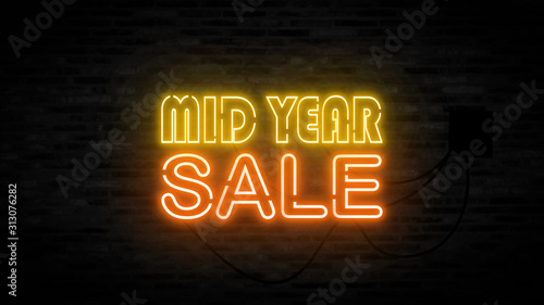 Mid year sale letter on the black brick wall for promotion sale and for clearance sale and for promote sale season. photo