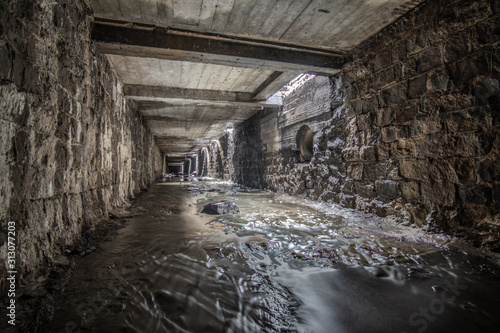 Old square rainwater tunnel