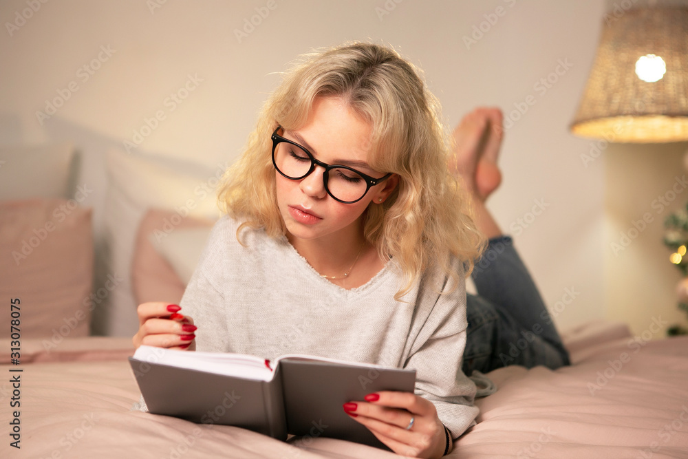 Young woman studying at night at home Young woman studying at night at home