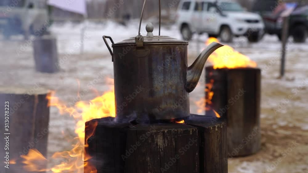 authentic kettle basked on a Finnish candle bonfire authentic kettle basked on a Finnish candle bonfire