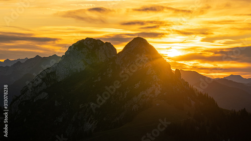 Goldener Sonnenaufgang hinter Roß- und Buchstein in den bayrischen Voraplen. photo