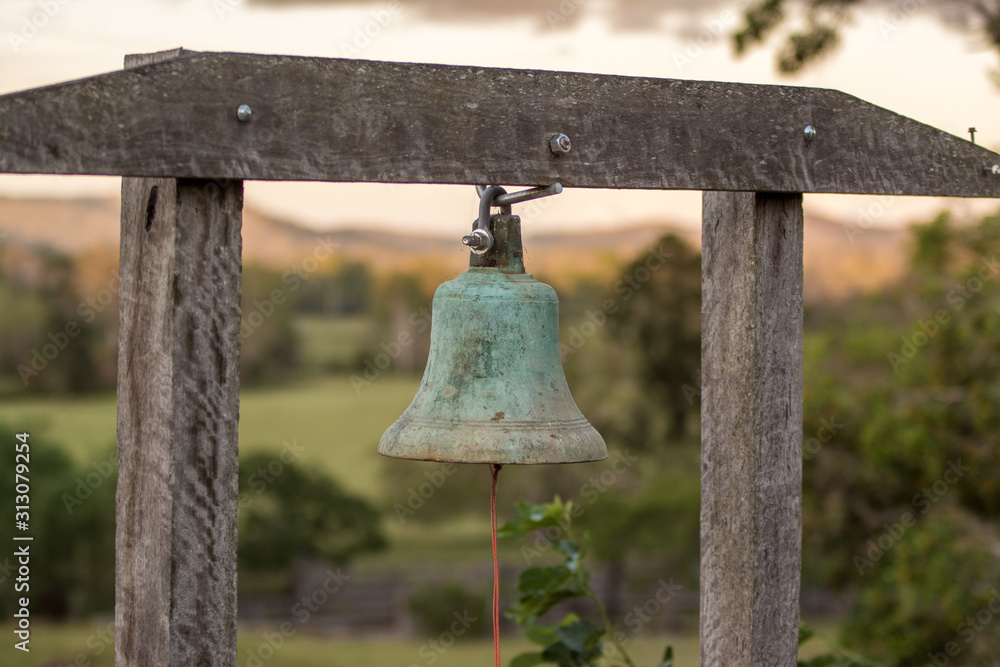 Fototapeta premium old wooden bell on stand 