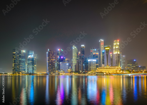 Science Art Museum, Singapore - Aug 2019 - CBD central business district museum view from Marina By blue hour sunset lights on