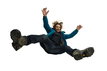 A second before falling. Caucasian young man falling down in moment with bright emotions and facial expression. Male model in casual clothes on white. Shocked, scared, screaming. Copyspace for ad.