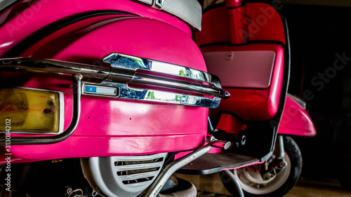 detail of pink scooter with chromed metallic fender