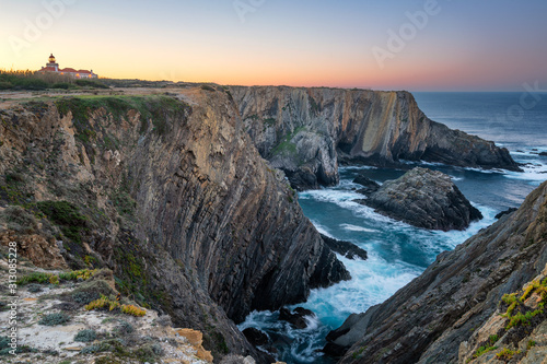 Cabo do Sardao Lighthouse Cape view at sunrise, in Portugal