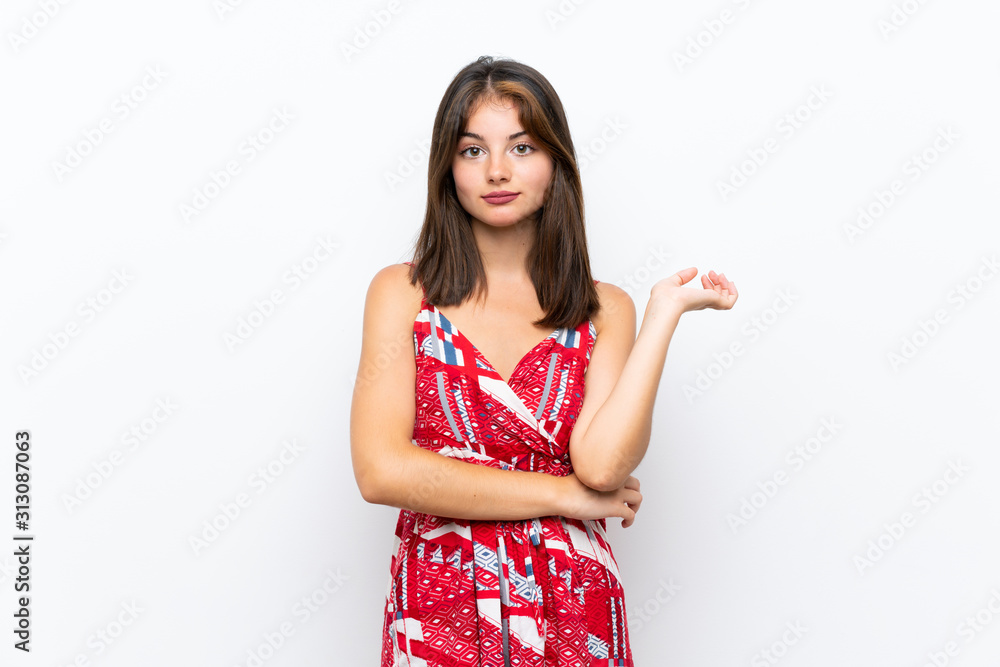 Caucasian girl in red dress over isolated white wall unhappy for not understand something Caucasian girl in red dress over isolated white wall unhappy for not understand something