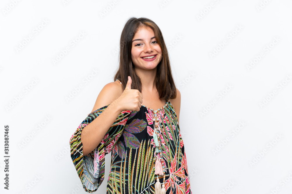 Caucasian young woman in colorful dress on isolated white background giving a thumbs up gesture Caucasian young woman in colorful dress on isolated white background giving a thumbs up gesture