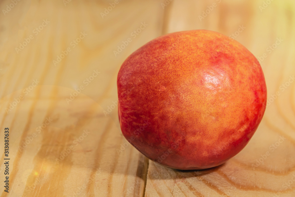 one nectarine green closeup wood background one nectarine green closeup wood background