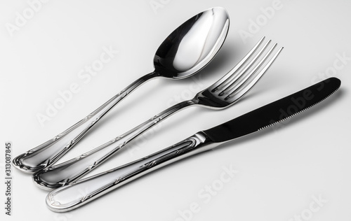 Spoon  fork and knife on a white background
