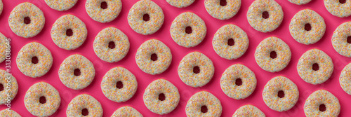 Banner 3:1. National Doughnut Day. Pattern from glazed donuts decorated colorful sprinkles on pink background. Flat lay. Top view. Unhealthy food