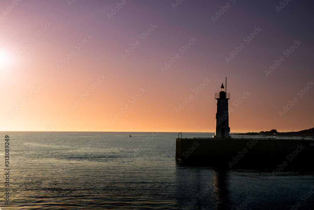 Anstruther, Fife, Scotland. Harbour village lighthouse at sunset.