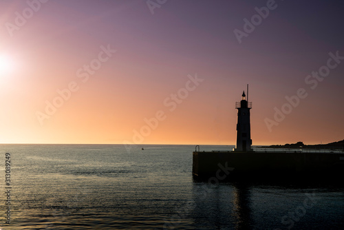 Anstruther, Fife, Scotland. Harbour village lighthouse at sunset. © cliff