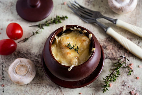 Wallpaper Mural Delicious julienne with mushrooms, chicken, Parmesan and thyme in a clay pot, fresh tomatoes and fresh mushrooms randomly scattered on a gray background Torontodigital.ca