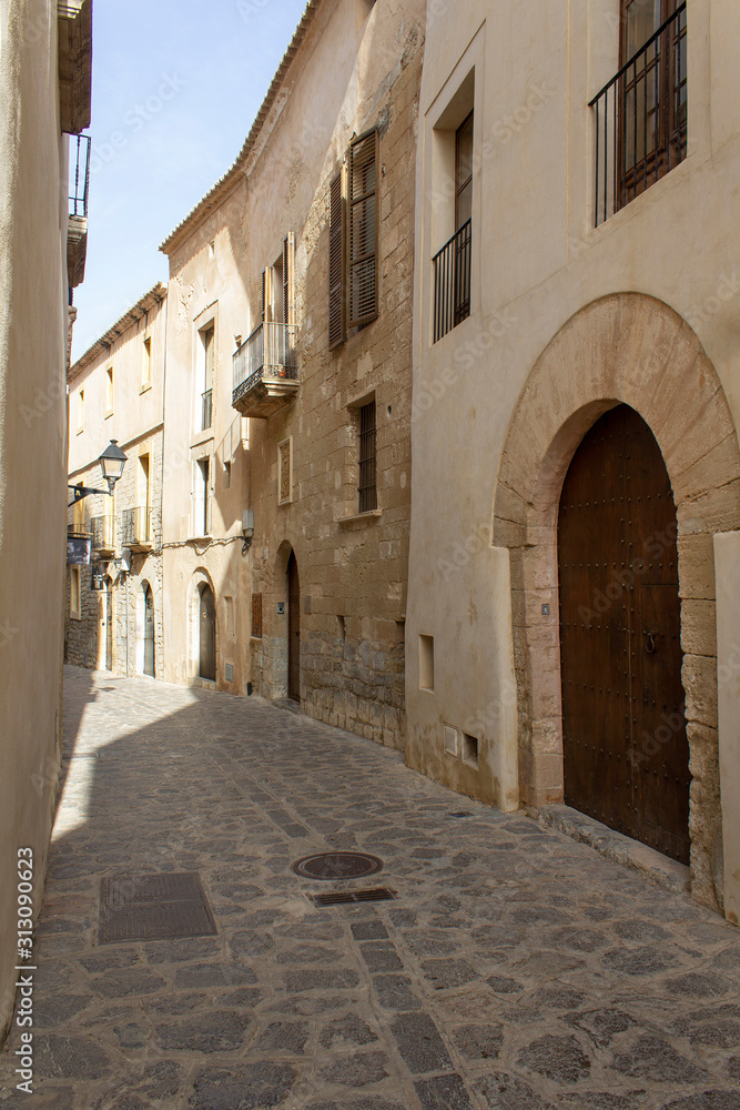 narrow street in old town facade house architecture of ibiza island spain mediterranean sea touristic 