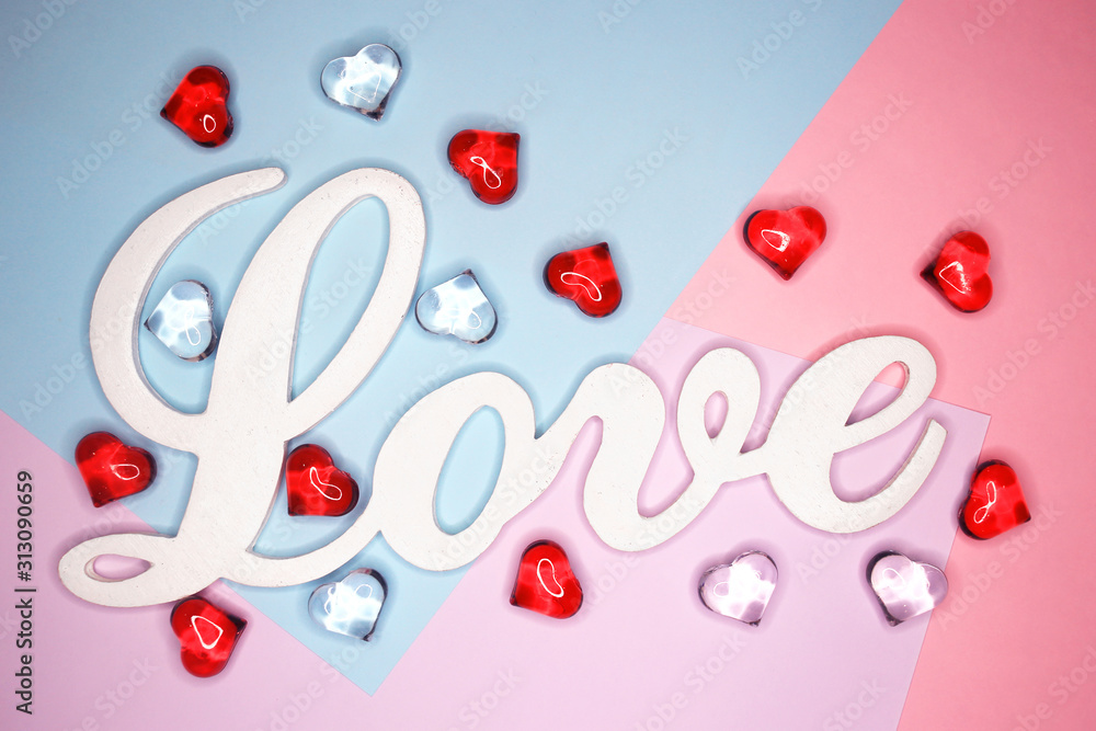 Word Love, on a pastel background with figures of hearts. Holiday concept. February 14, Valentine's Day, mother's day. Word Love, on a pastel background with figures of hearts. Holiday concept. February 14, Valentine's Day, mother's day.