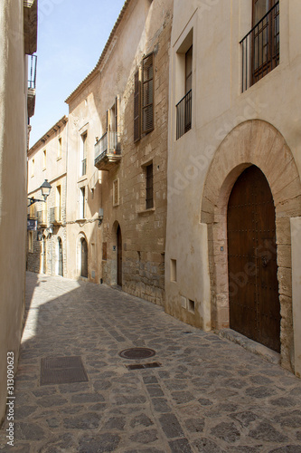 narrow street in old town facade house architecture of ibiza island spain mediterranean sea touristic 