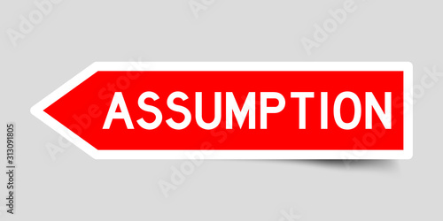 Red color arrow sticker with word assumption on gray background