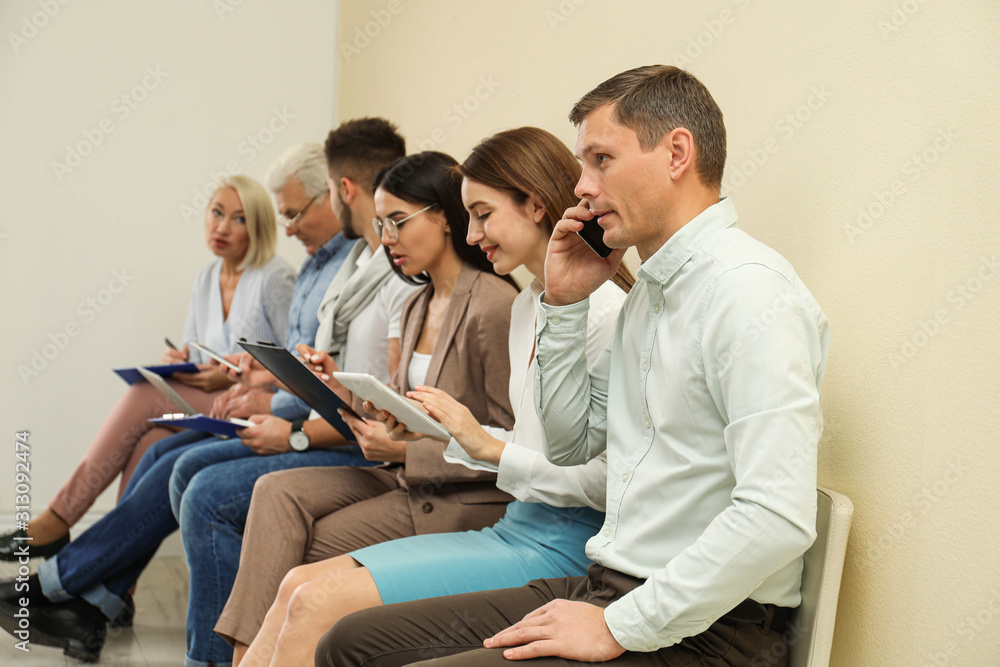 People waiting for job interview in office People waiting for job interview in office