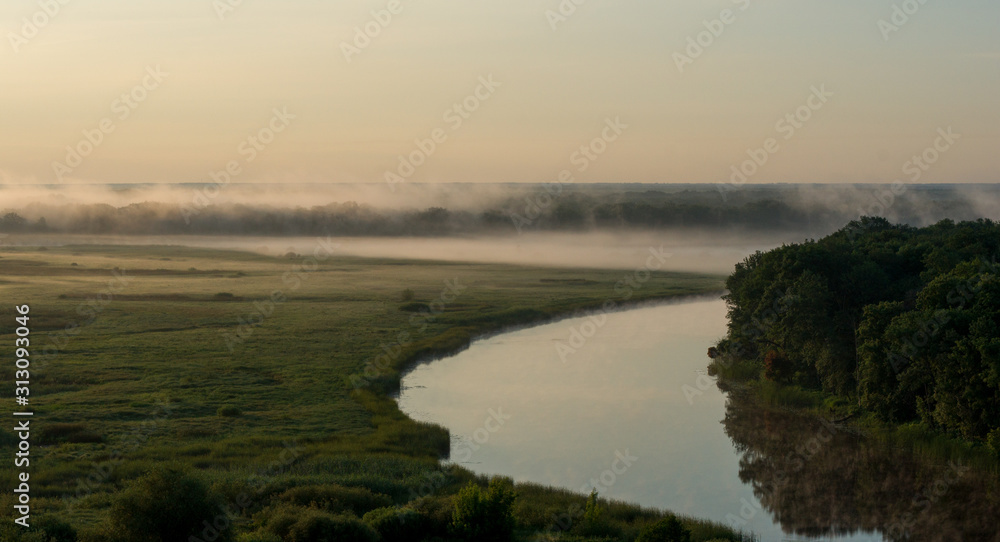 Summer morning fog over the river in the Voronezh region, nature of Russia.