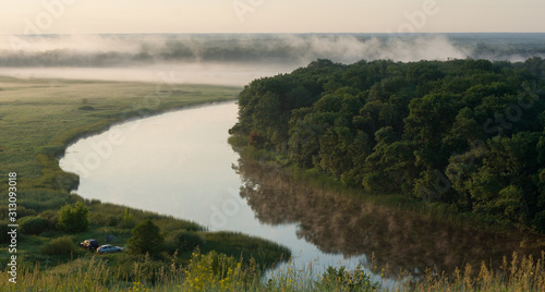 Camping with cars and summer morning fog over the river in the Voronezh region, nature of Russia.