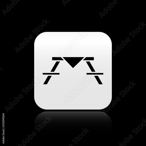 Black Picnic table with benches on either side of the table icon isolated on black background. Silver square button. Vector Illustration