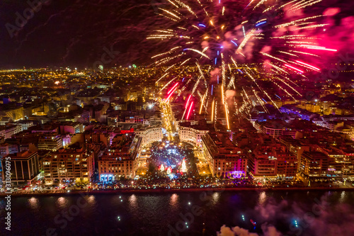 Aerial view of Aristotelous square in Thessaloniki during New Year celebrations with fantastic multi-colored fireworks © ververidis