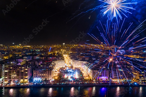 Aerial view of Aristotelous square in Thessaloniki during New Year celebrations with fantastic multi-colored fireworks