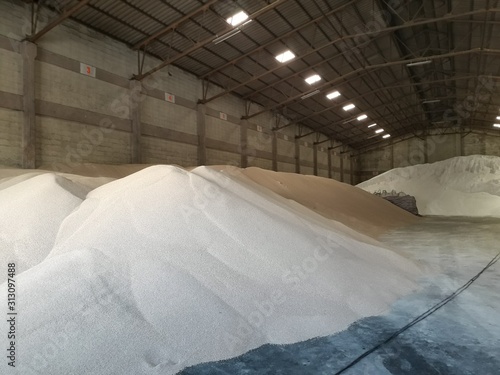 Chemical fertilizer piles in the warehouse are waiting for the delivery of the type of bulk.
