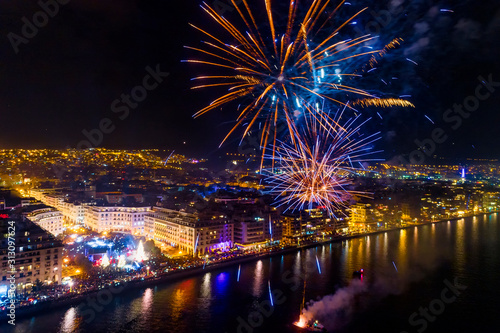 Aerial view of Aristotelous square in Thessaloniki during New Year celebrations with fantastic multi-colored fireworks