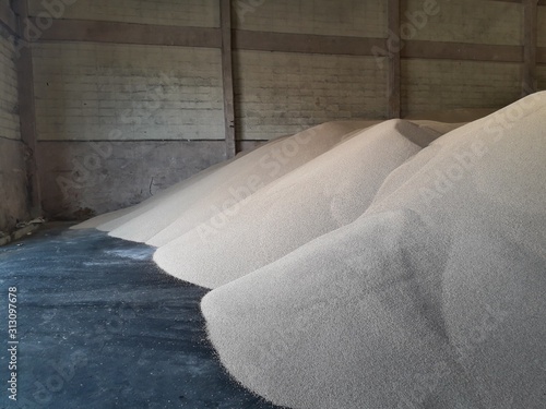 Chemical fertilizer piles in the warehouse are waiting for the delivery of the type of bulk. photo