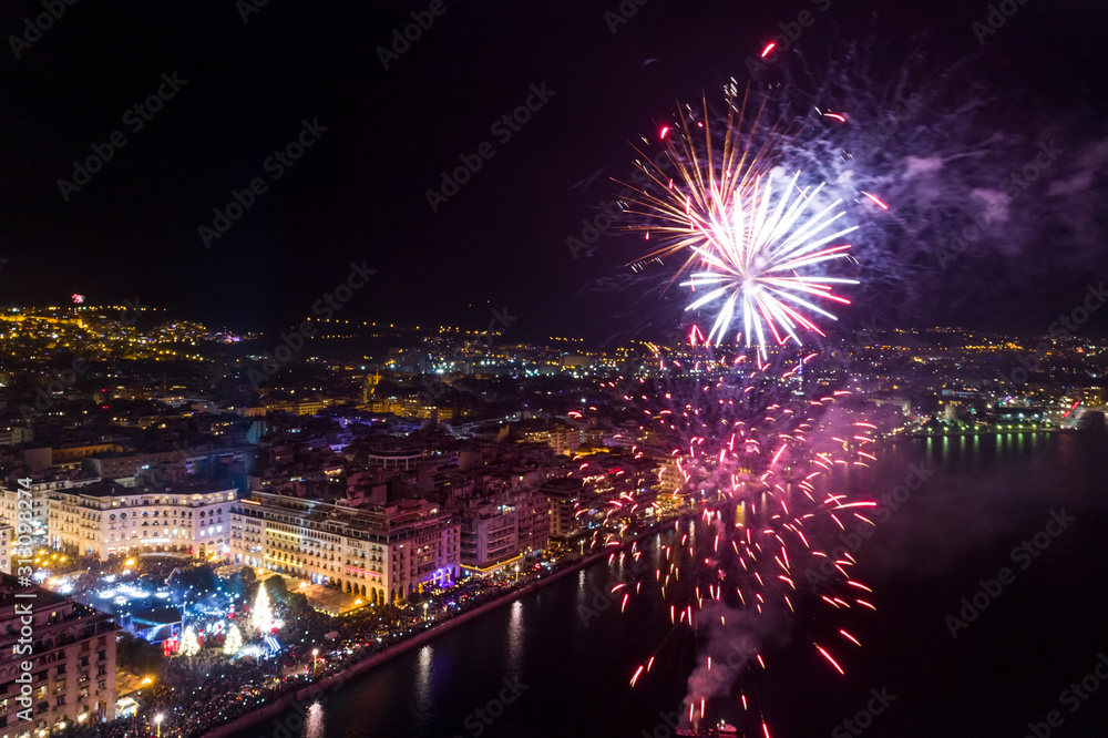 Aerial view of Aristotelous square in Thessaloniki during New Year celebrations with fantastic multi-colored fireworks Aerial view of Aristotelous square in Thessaloniki during New Year celebrations with fantastic multi-colored fireworks