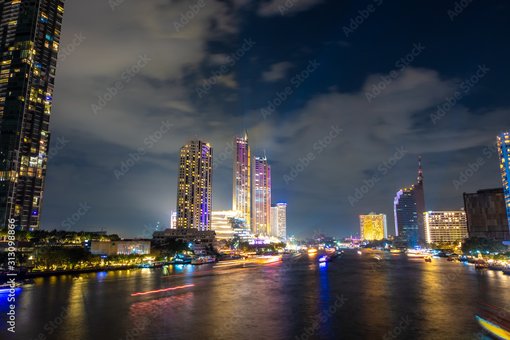 Fototapeta premium City view by the river Bright night The beauty of the capital