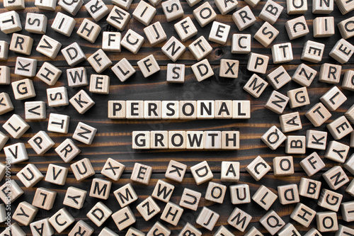 Personal growth - word from wooden blocks with letters, personal development concept, gray background