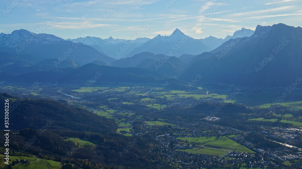 Aerial panorama of Salzburg and Alps from the top of Untersberg mountain in Austria.