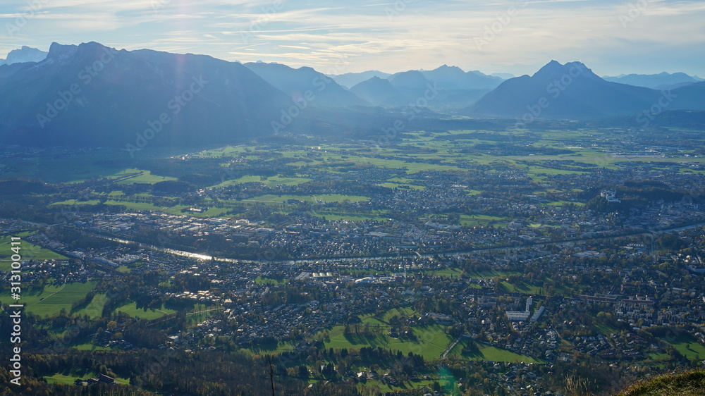 Aerial panoramic view of Salzburg and Alps from the top of Untersberg mountain in Austria.