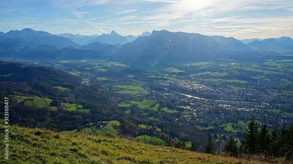 Fototapeta premium Aerial panorama of Salzburg and Alps from the top of Untersberg mountain in Austria.