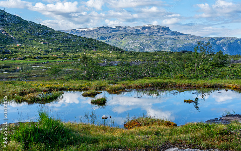 Mountain lake landscape, way to Trolltunga rock, Odda, Norway