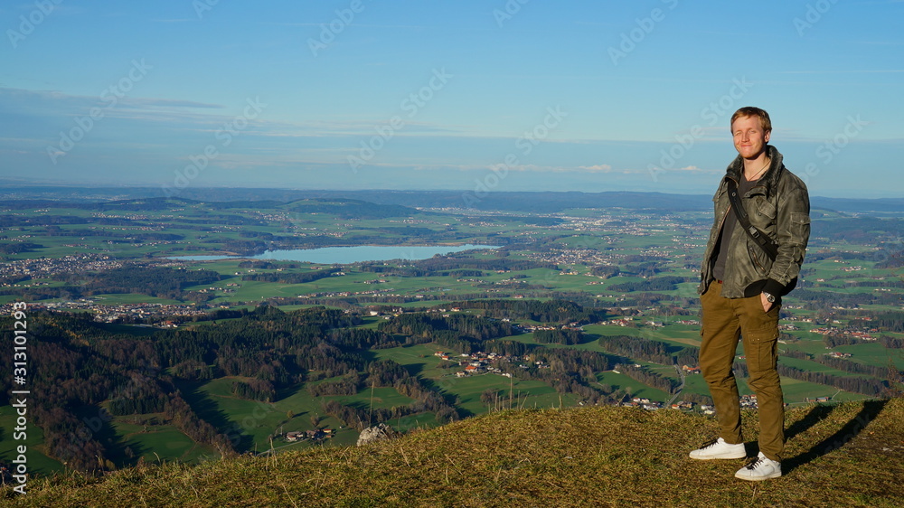 Tourist at the top Untersberg mountain and background with aerial panoramic landscape in Austria.